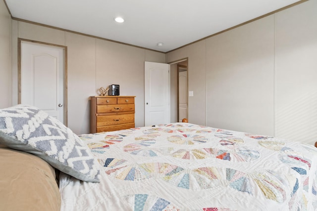 bedroom with ornamental molding