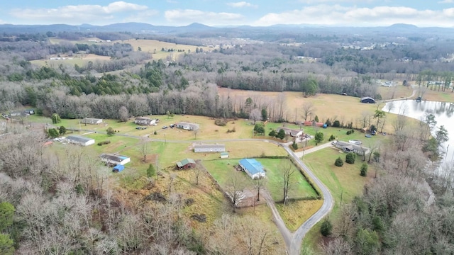 drone / aerial view featuring a water and mountain view