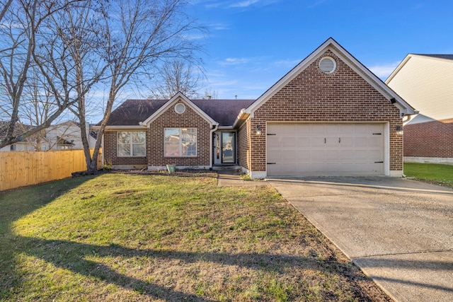 view of front of home featuring a front lawn and a garage