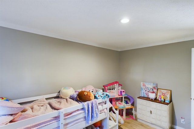 bedroom with light hardwood / wood-style flooring