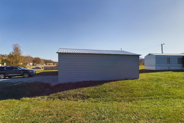 view of outdoor structure with a yard