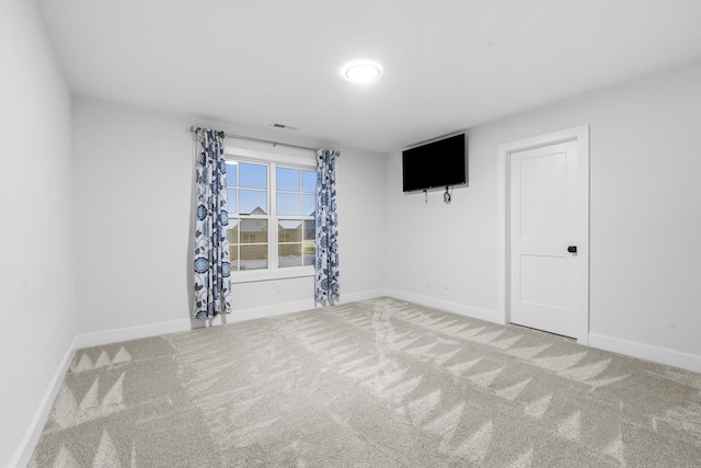 unfurnished room with carpet floors