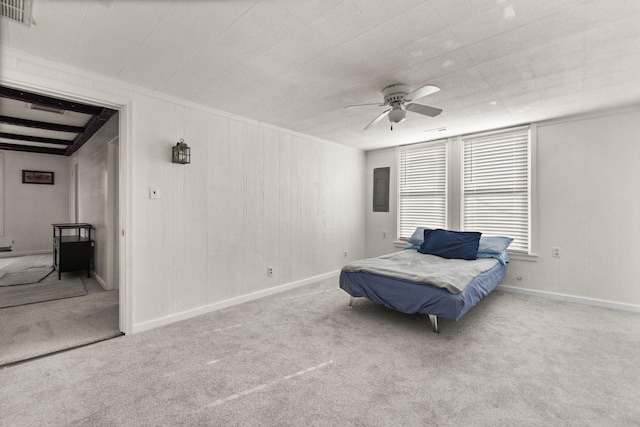 carpeted bedroom with ceiling fan and ornamental molding