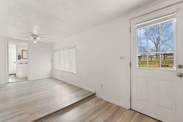 entryway featuring ceiling fan and light hardwood / wood-style flooring