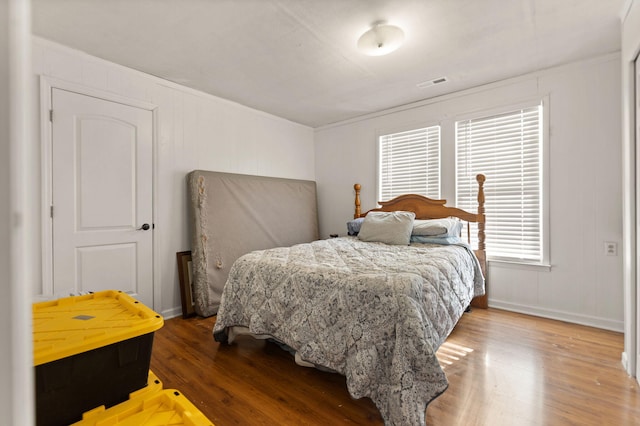 bedroom with wood-type flooring