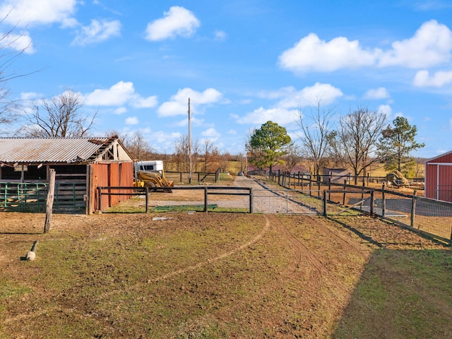 view of yard with a rural view