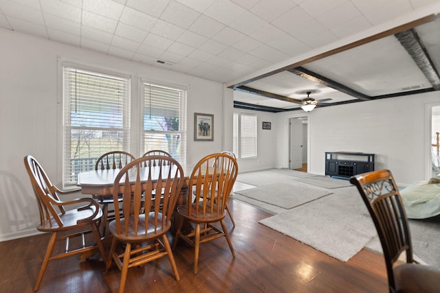 dining space with dark hardwood / wood-style flooring and ceiling fan