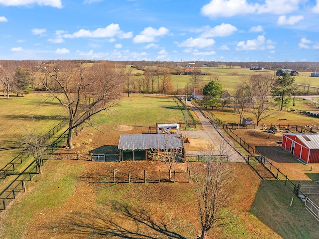 birds eye view of property with a rural view