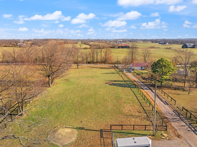 birds eye view of property with a rural view