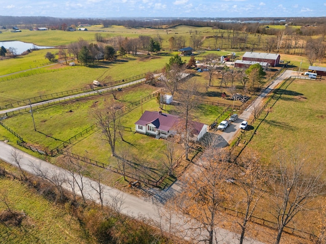 birds eye view of property featuring a rural view and a water view