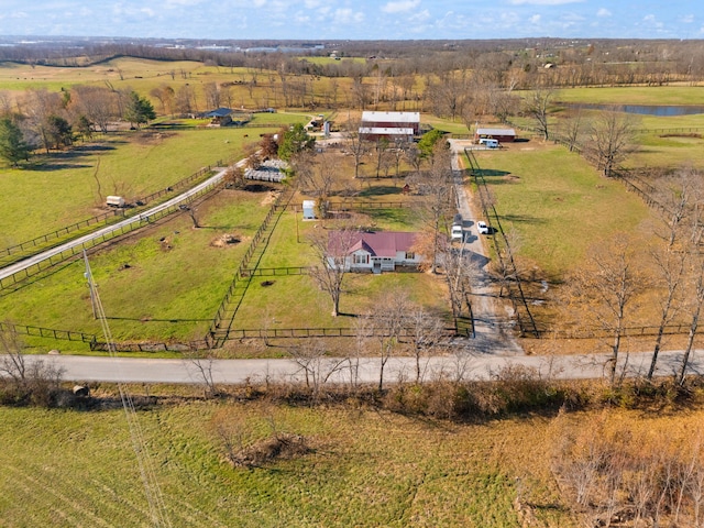 drone / aerial view featuring a water view and a rural view