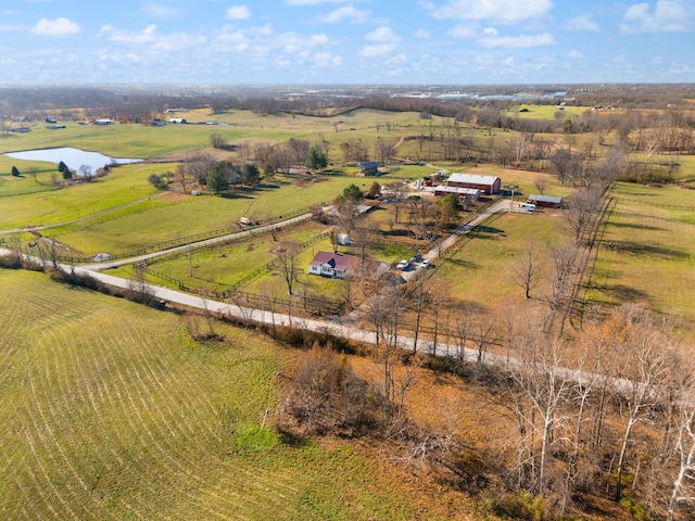 drone / aerial view featuring a rural view and a water view