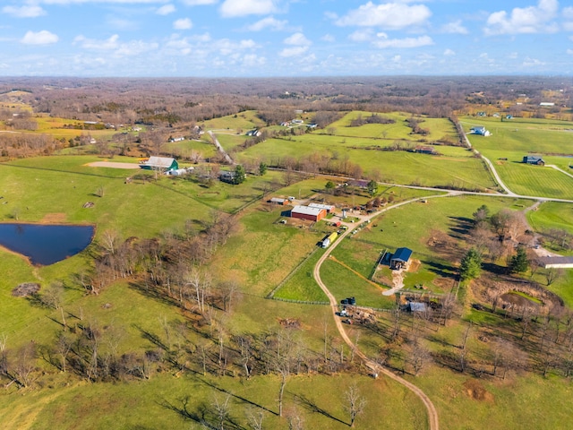 birds eye view of property with a water view and a rural view