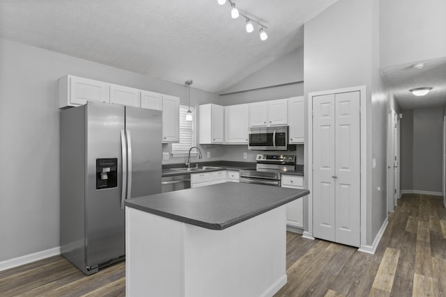 kitchen featuring white cabinetry, sink, stainless steel appliances, dark hardwood / wood-style floors, and a textured ceiling