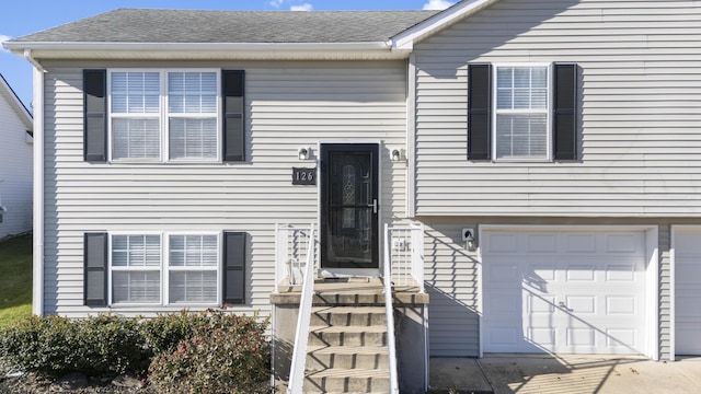 bi-level home featuring a garage