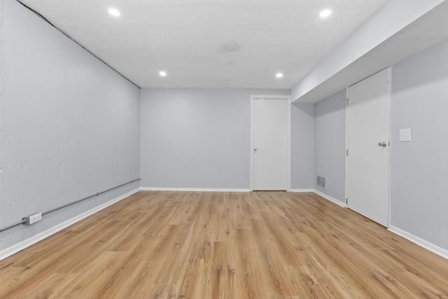 basement featuring light hardwood / wood-style floors