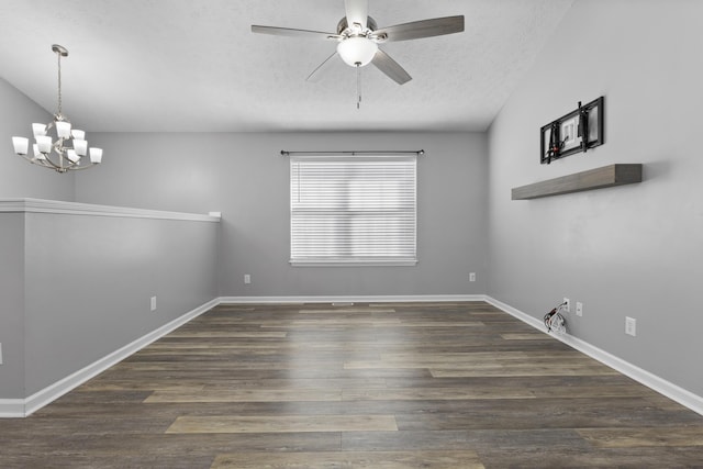 unfurnished room featuring lofted ceiling, dark hardwood / wood-style flooring, ceiling fan with notable chandelier, and a textured ceiling