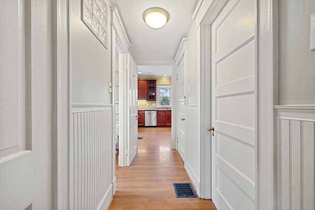 corridor featuring light hardwood / wood-style floors