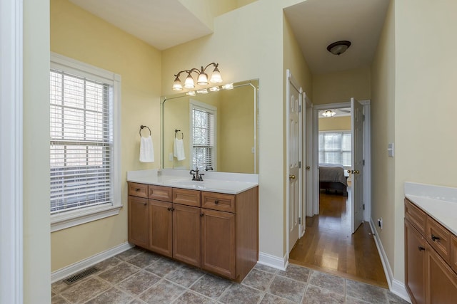 bathroom featuring vanity and wood-type flooring