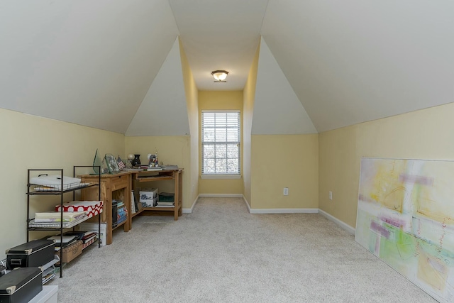 additional living space with light carpet and vaulted ceiling