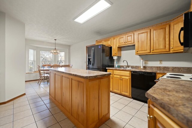 kitchen featuring sink, black appliances, light tile patterned floors, a kitchen island, and hanging light fixtures