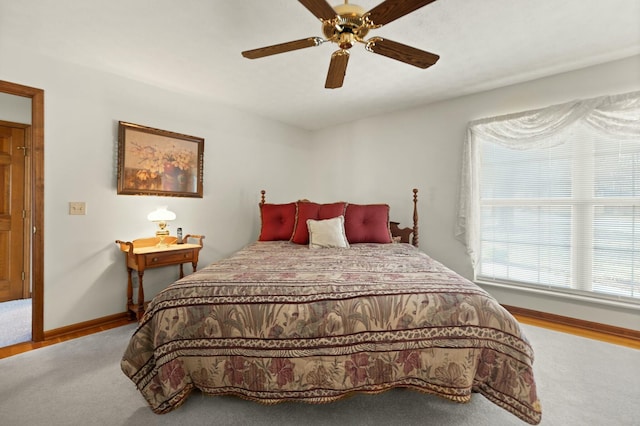 bedroom with hardwood / wood-style floors and ceiling fan