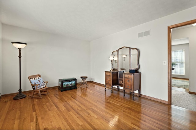 living area featuring hardwood / wood-style floors