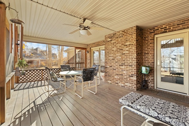 wooden deck featuring ceiling fan