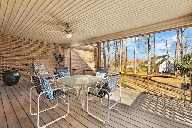 wooden deck featuring ceiling fan