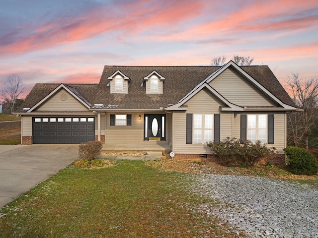 view of front of house with a lawn and a garage