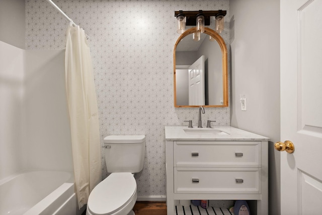 full bathroom featuring wood-type flooring, vanity, toilet, and shower / tub combo with curtain