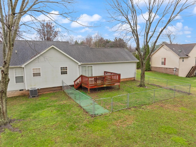 rear view of property with central air condition unit, a deck, and a lawn