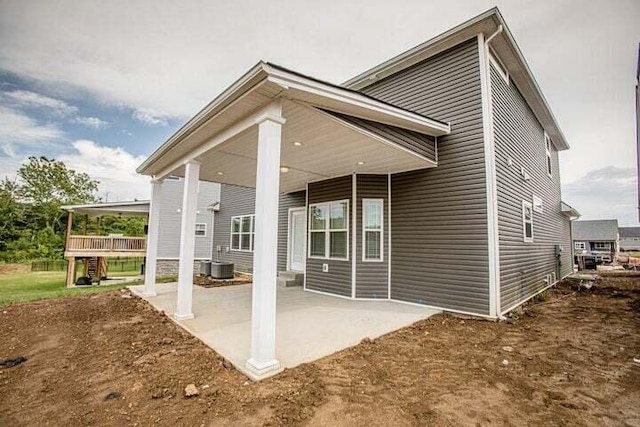 back of house featuring a patio and cooling unit