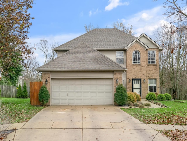 front of property featuring a front yard and a garage