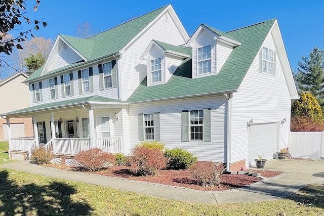 view of front of property with covered porch and a garage