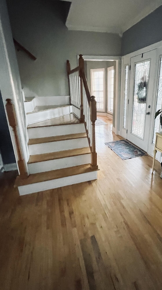 entryway with hardwood / wood-style flooring