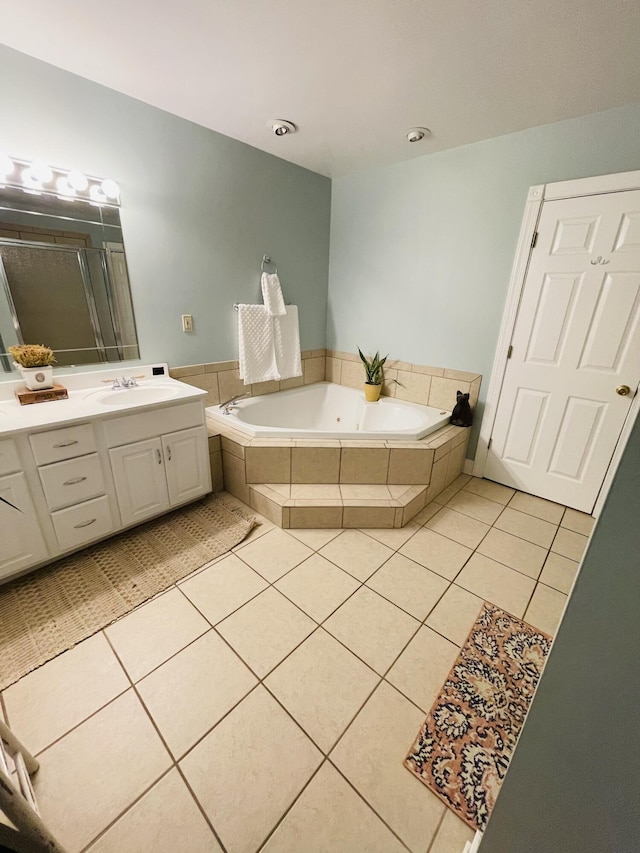 bathroom featuring tile patterned flooring, vanity, and independent shower and bath