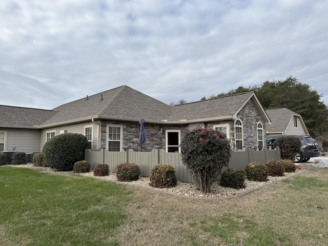 364 Cathedral Pl, Bronston, KY 42518 - view of side of home featuring a shingled roof, a yard, and stone siding