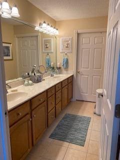 bathroom featuring vanity and tile patterned flooring