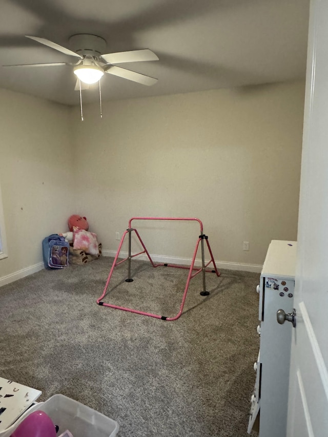 recreation room with carpet flooring and ceiling fan