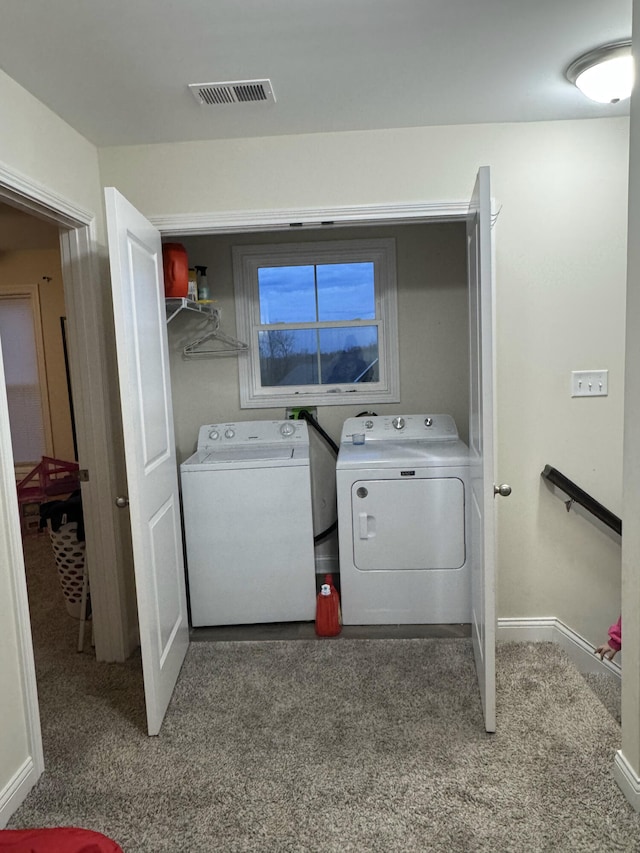 laundry room with dark colored carpet and washing machine and dryer