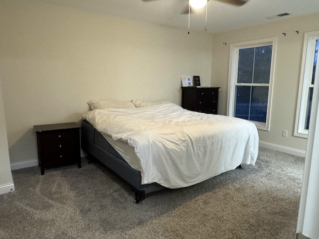 bedroom featuring ceiling fan and carpet