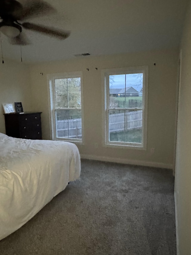 carpeted bedroom with ceiling fan