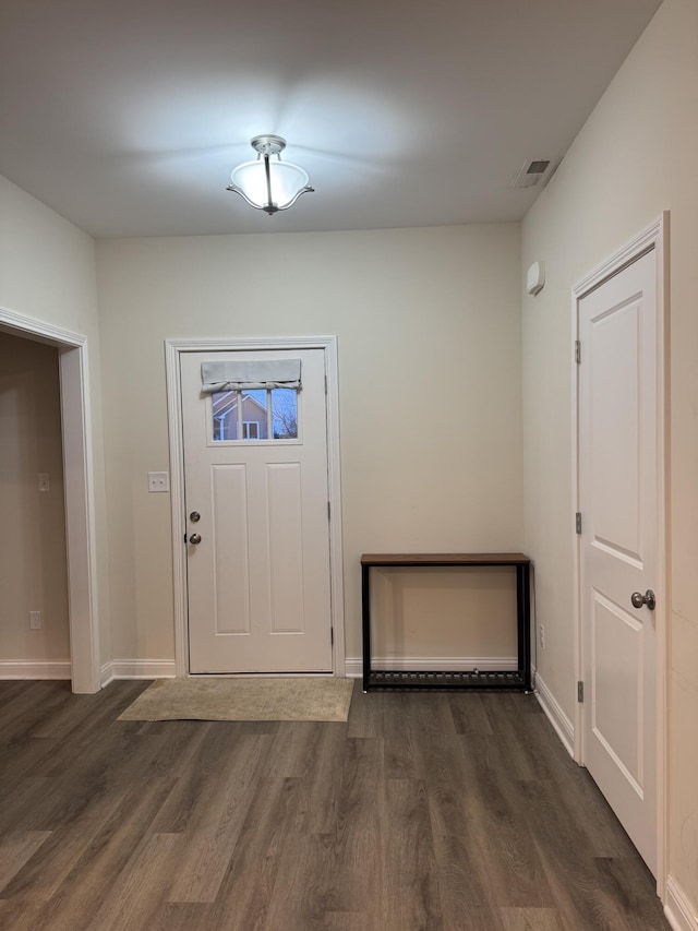 foyer entrance with dark hardwood / wood-style flooring