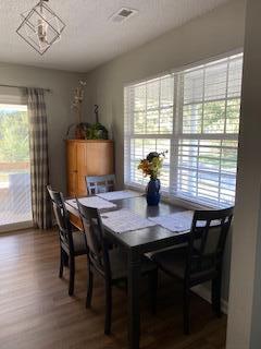 dining room with hardwood / wood-style floors