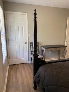 bedroom featuring hardwood / wood-style flooring