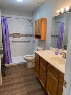 bathroom featuring a shower with curtain, vanity, toilet, and wood-type flooring