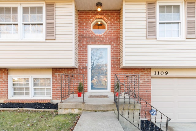 doorway to property featuring a garage