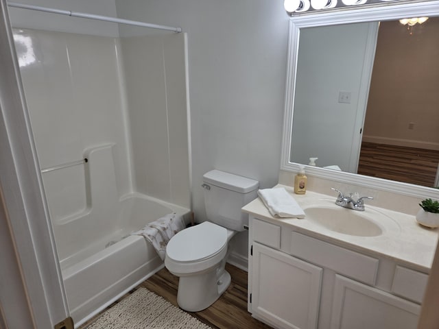 full bathroom with toilet, vanity, shower / bath combination, and hardwood / wood-style flooring