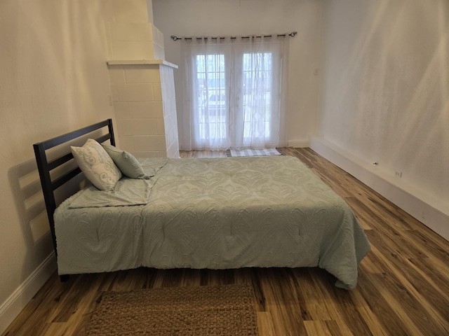 bedroom with hardwood / wood-style floors